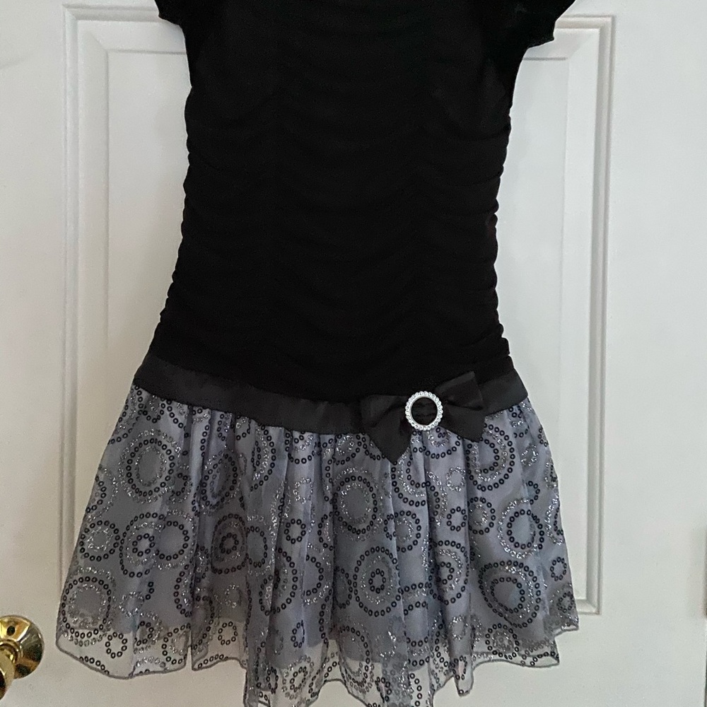 Girl’s black dress.